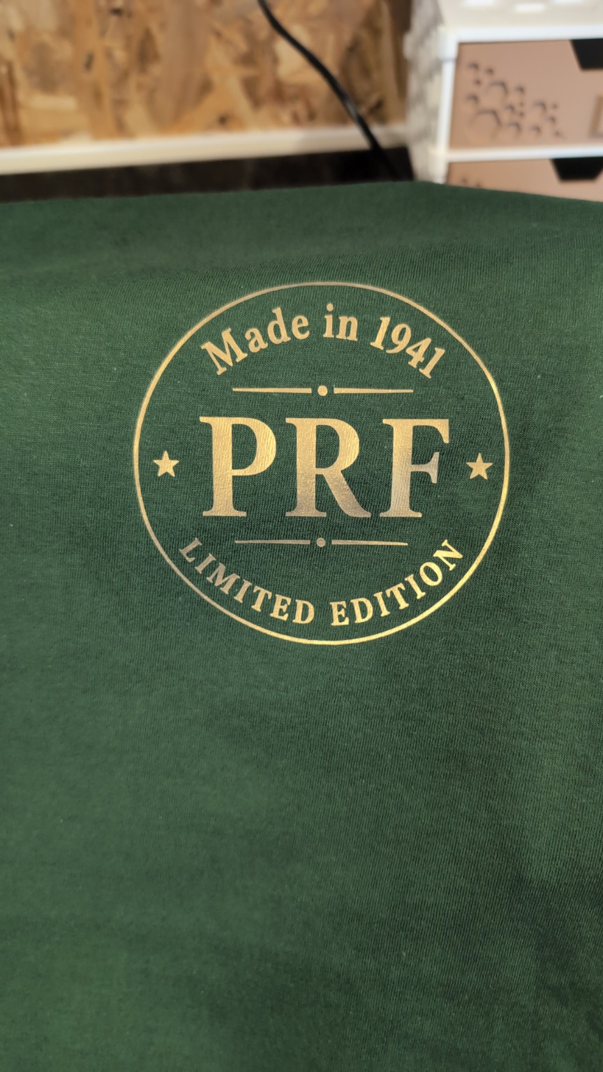 Gold personalised print on a green garment