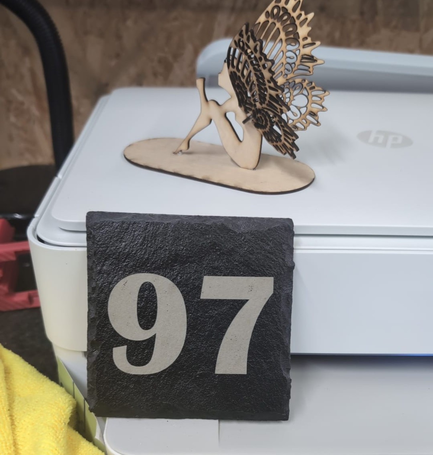 Layered laser-cut butterfly and house number 97