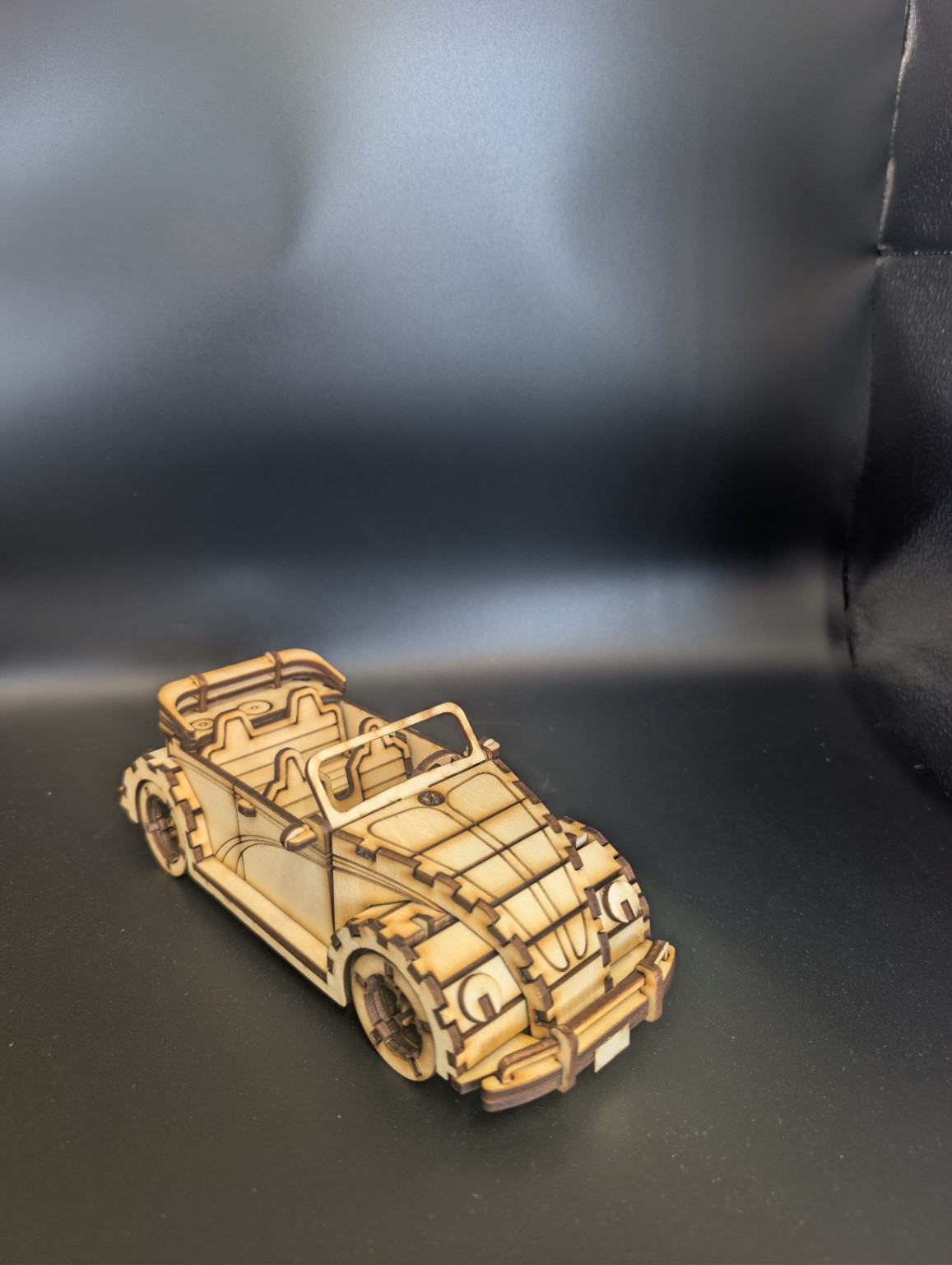 Laser-cut wooden classic convertible model viewed from the front corner