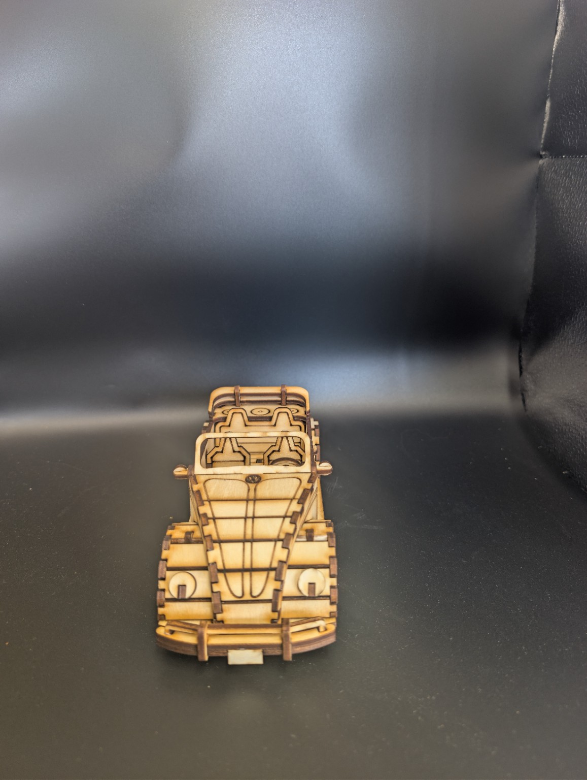 Front view of a detailed laser-cut wooden classic convertible model