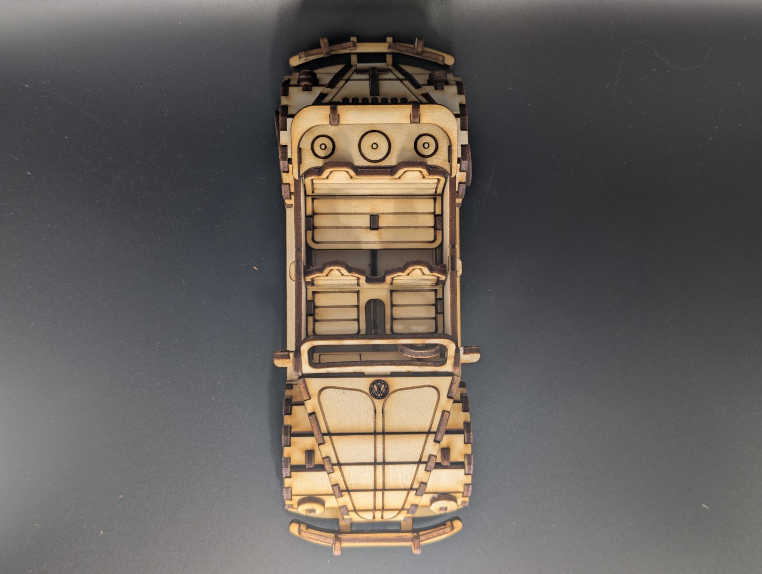 Overhead view showing the interior details of a laser-cut wooden convertible model